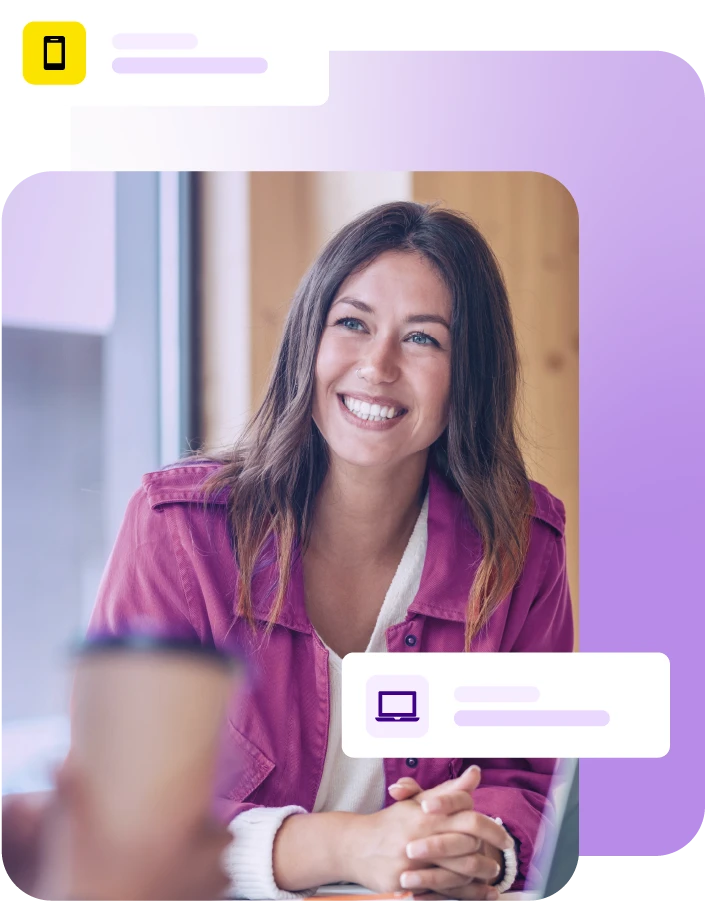 Lady smiling during a meeting with laptop on the table